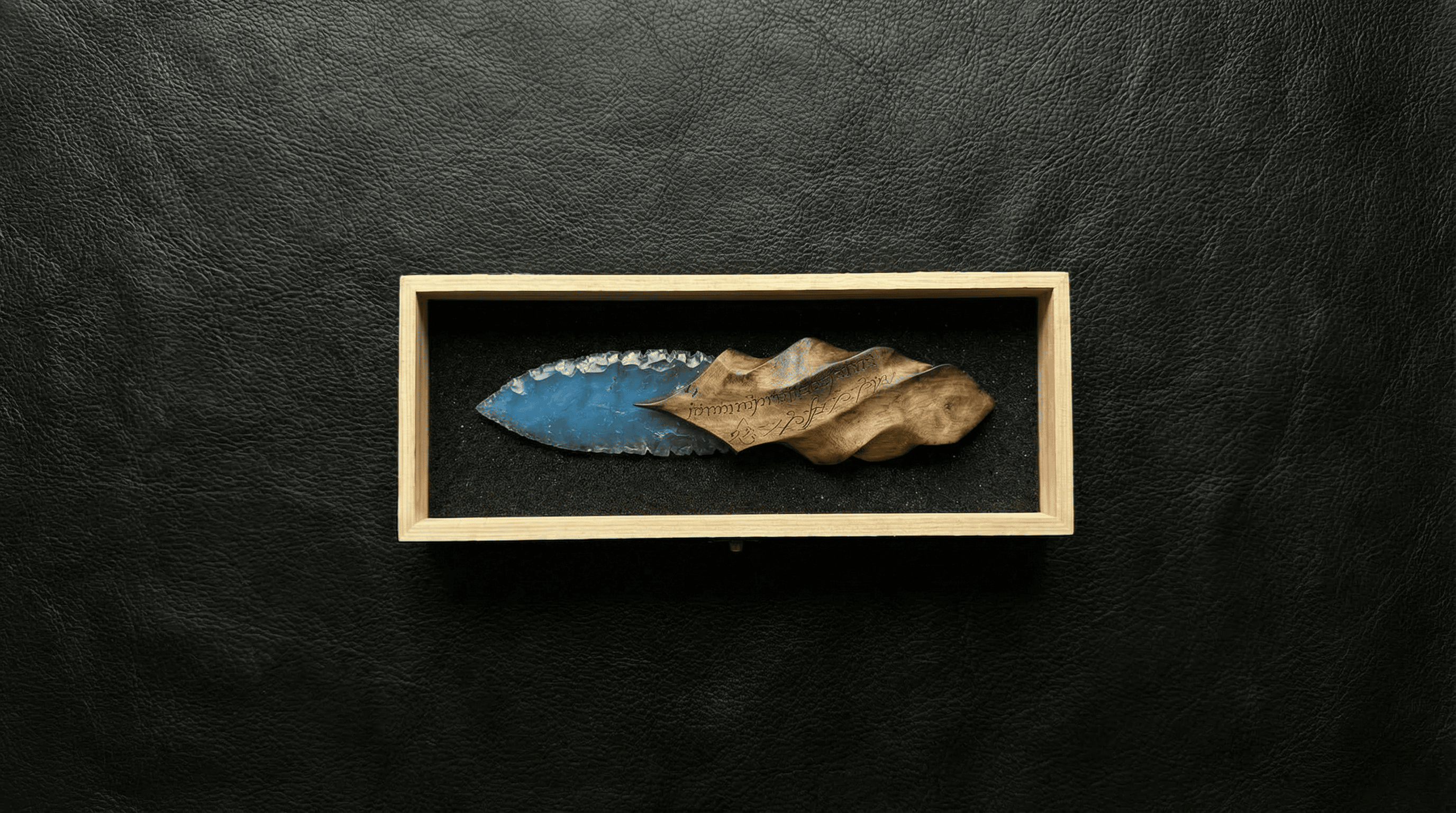 All products banner, handcrafted stone blade knife displayed in a wooden gift box on black leather background