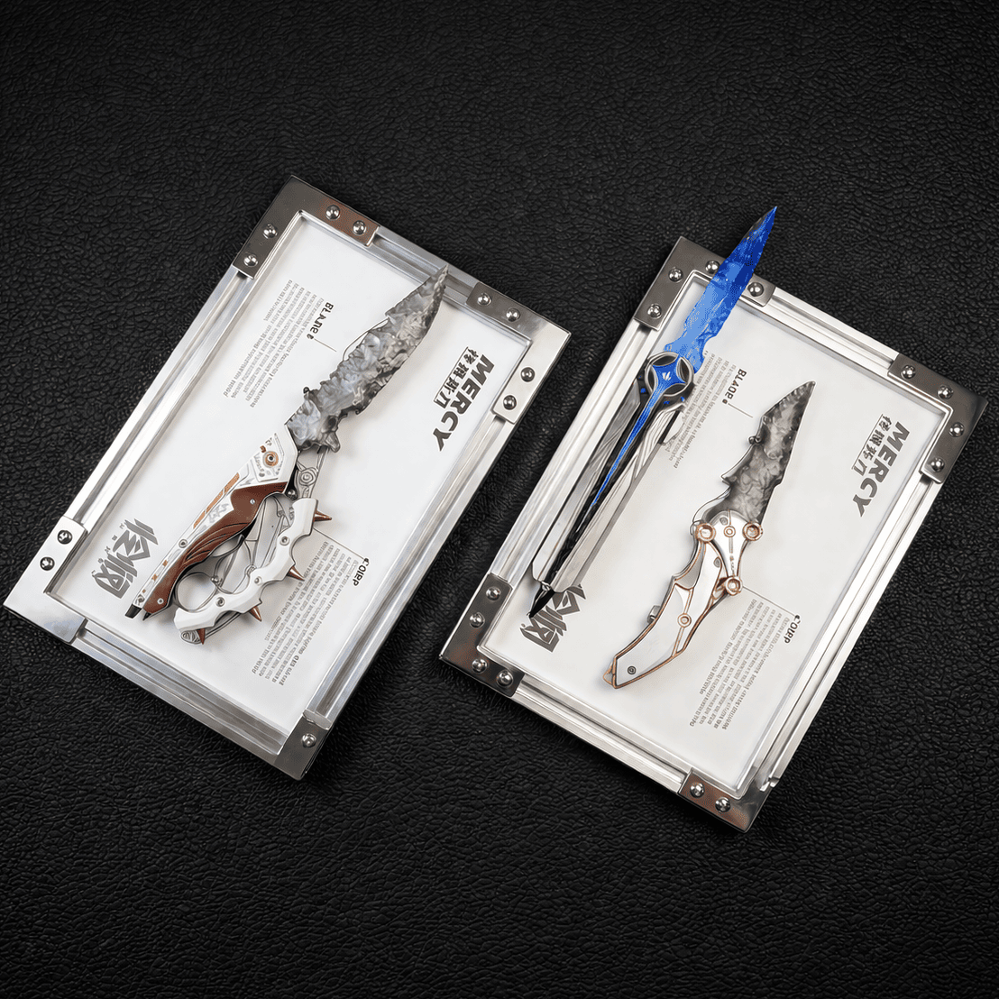 Stoneblade Forge collector knives displayed in clear presentation frames with silver and blue blades on black textured background