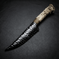 Marauder obsidian crystal stone blade dagger with antler handle on black leather background