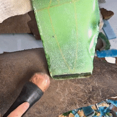Hand-hammering a green crystal blank to form a rough preform for a hand-knapped stone blade