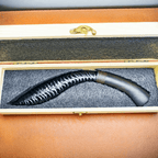 Stoneblade Forge black obsidian kukri in foam-lined wooden gift box with curved dark wooden handle