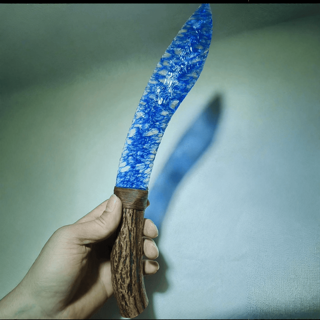 Claw Stone Blade — Abysscrest (Ocean Blue, Crystal), hand-held curved blade close-up