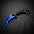 Deep-blue crystal claw stone blade on black leather background, top view