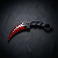 Red crystal claw stone blade on black leather background, top view