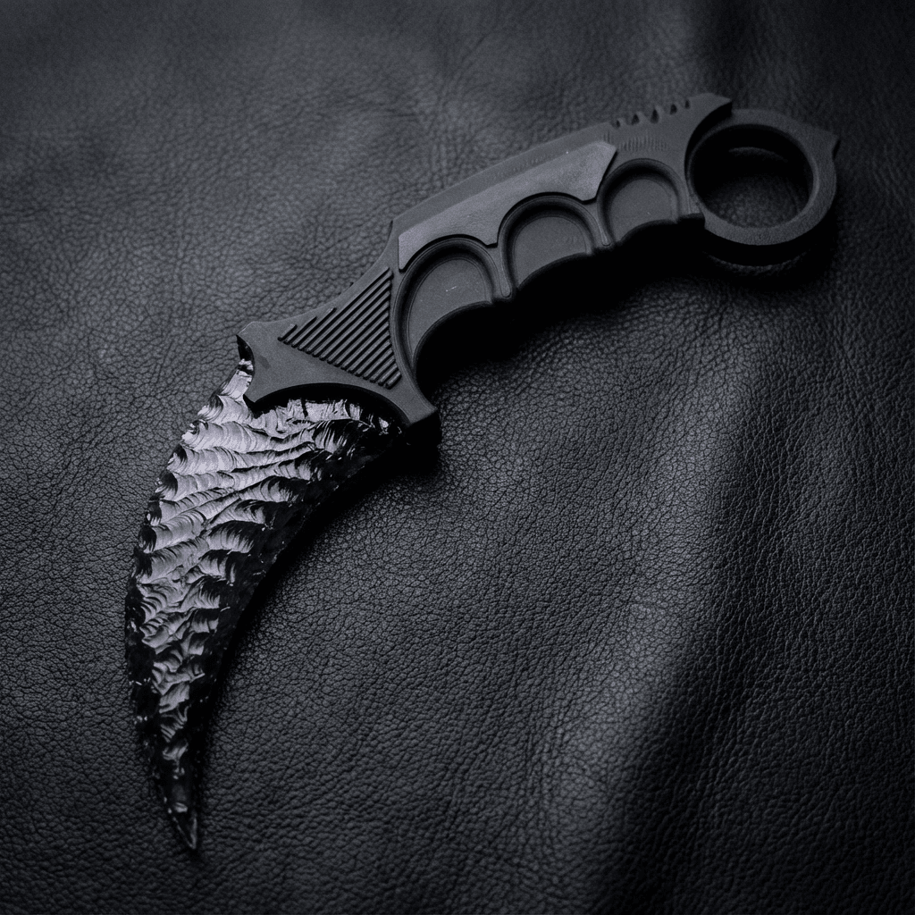 Black crystal claw stone blade on black leather background, top view
