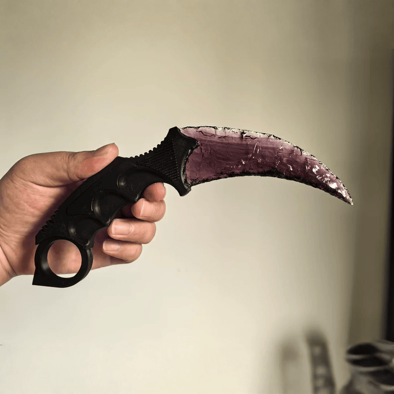 Handheld view of Claw Stone Blade Wraith showing full curved amethyst crystal blade
