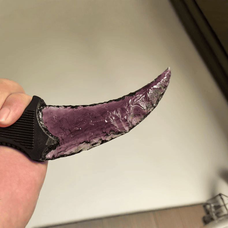 Close-up of Wraith amethyst crystal claw blade texture and glossy edge detail