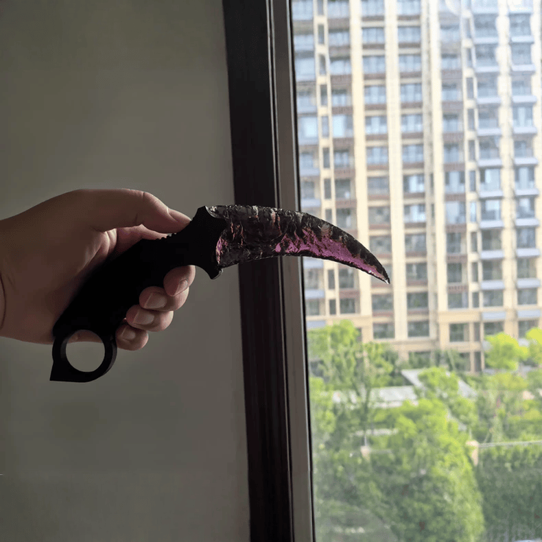 Claw Stone Blade Wraith in amethyst crystal held near window with city background