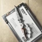 Grey knapped-style dagger with red-and-white mechanical-style handle displayed on the “MERCY” board in a metal frame (Delta Force).