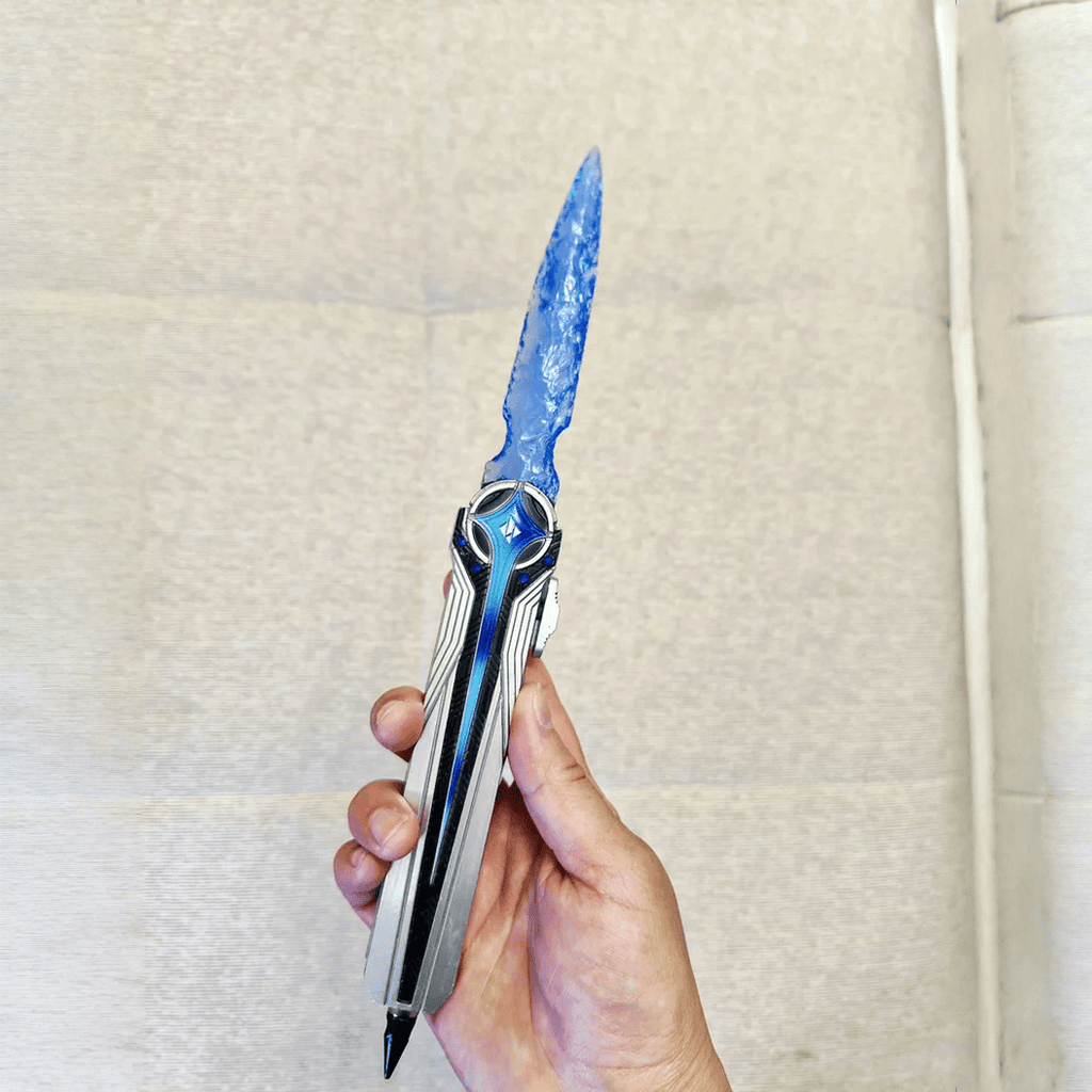 Handheld portrait of the blue crystal-like dagger with metallic handle against a clean neutral background (Delta Force).