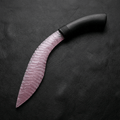 Blush pink rose quartz Curved Stone Blade Nightbloom on black leather background