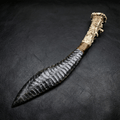 Silver sheen obsidian Curved Stone Blade Stagshade with antler handle on black leather background