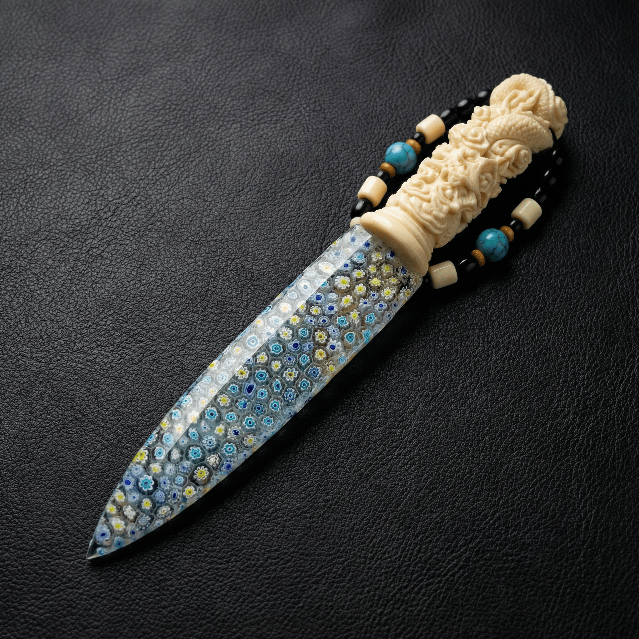 Stoneblade Forge Dagger Stone Blade “Moonrime” — mosaic-pattern blade with blue, white, and yellow speckled details, paired with an ornate carved ivory-tone handle and beaded lanyard on black leather.