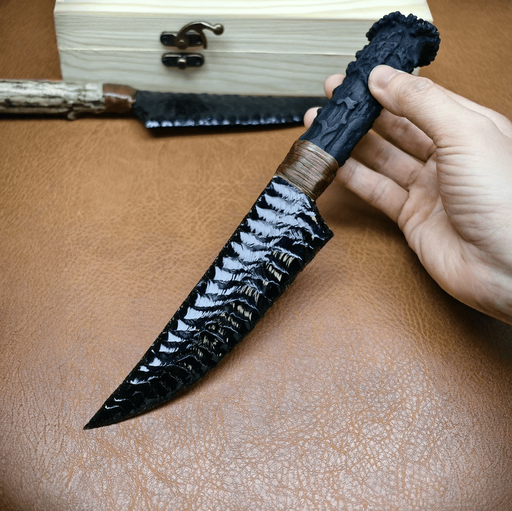 Obsidian crystal stone blade dagger Marauder in hand on brown leather, antler handle wrap detail
