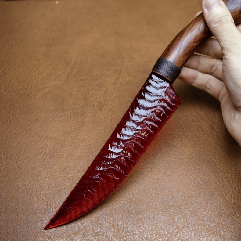 Marauder obsidian crystal dagger held in hand on brown leather background